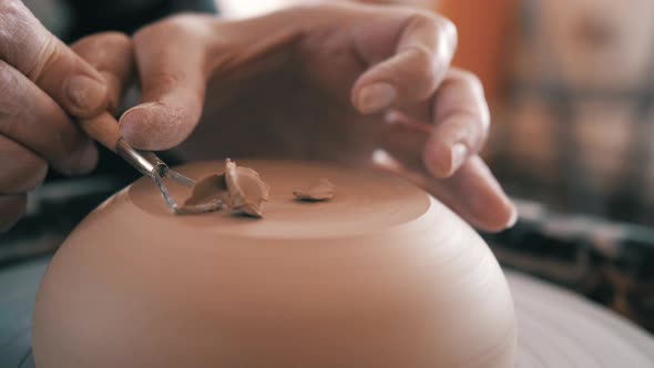 Potter, Craftsman is Working on Pottery Wheel, Rotating the Wheel Fast, Removes Extra Clay