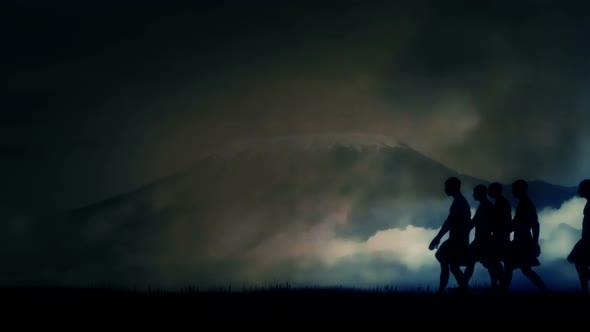 Tribal African Men Walking Close Yo Mount Kilimanjaro Under Storm