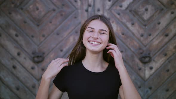 Portrait of Beautiful Young Woman with Attractive Smile