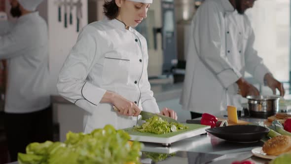 Portrait of Authentic Chef Preparing Organic Ingredients in Kitchen