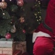 Santa Putting Present Boxes under Christmas Tree - VideoHive Item for Sale