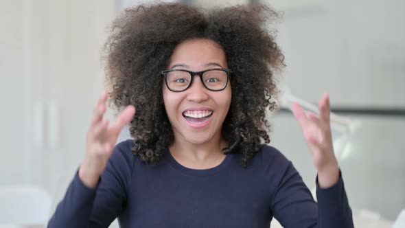 Portrait of African Woman Celebrating Success