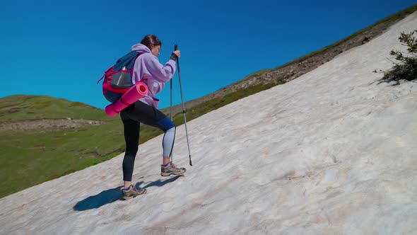 Female Climber in Mountain Travelling Alone Trekking and Hiking Over Mount Slope