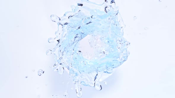 Super Slow Motion Shot of Water Vortex Splash Isolated on Light Blue Background at 1000Fps