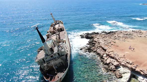 Flying Over Coastline with Broken Ship