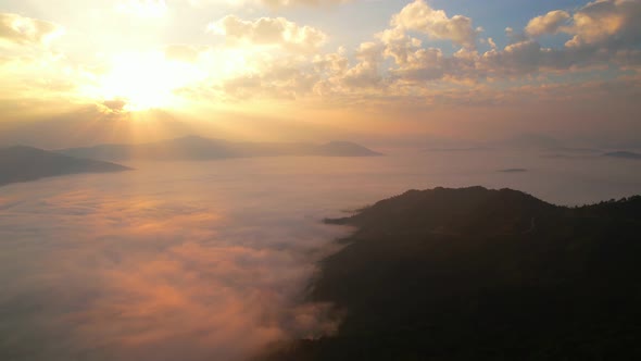 Flying over the clouds during morning sunrise.  wonderful morning sunrise natural Landscape.