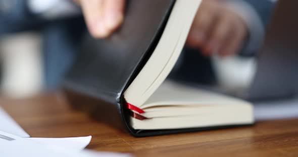 Businessman Examines Daily Planner at Workplace Slow Motion  Movie