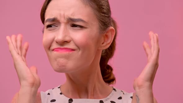 Young Woman Shows That She Does Not Want To Hear Anything, Waving Her Hands.