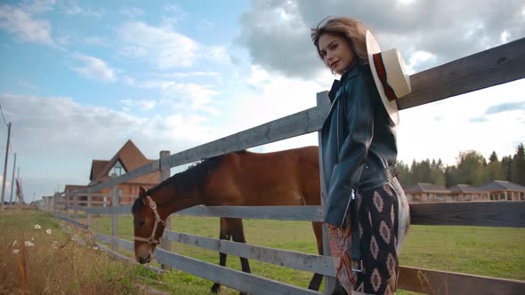 Stylish Lady Standing Near Horse