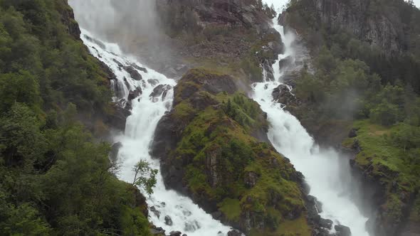 Amazing twin waterfalls cascading down mountain, Latefossen Waterfall, aerial