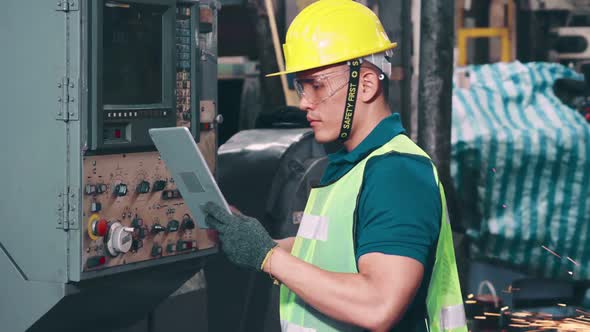 Smart Factory Worker Using Machine in Factory Workshop