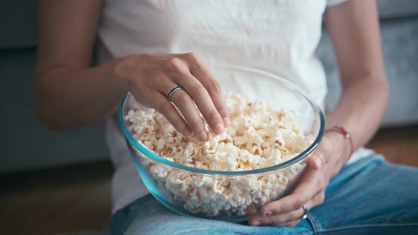 Close-up Shot of a Woman's Hand Taking Popcorn