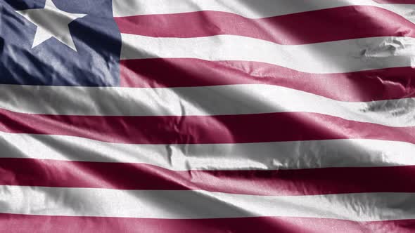 Liberia textile flag waving on the wind. Slow motion. 20 seconds loop.