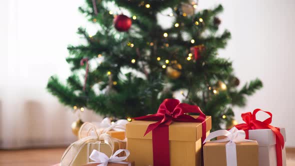 Gift Boxes on Sheepskin at Christmas Tree 7