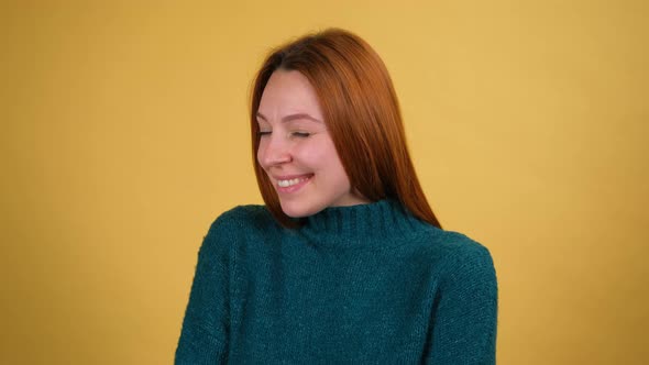 Young Red Hair Woman Posing Isolated on Yellow Color Background Studio