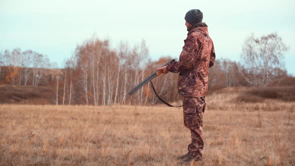 The Hunter Loads the Shotgun on the Hunt