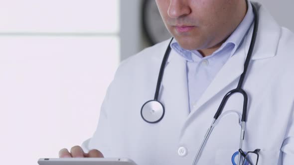 Closeup of doctor using digital tablet