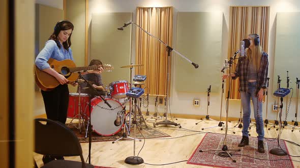 Music band performing in a studio