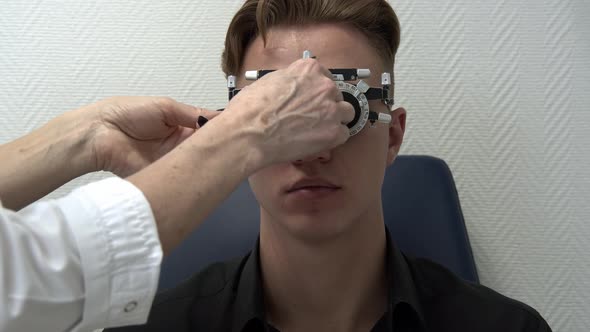 A Young Man is Having His Eyes Checked