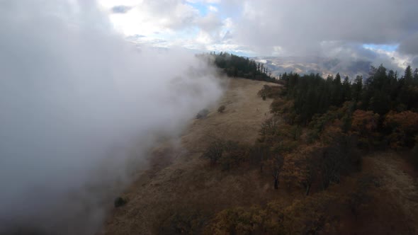 Ridgeline Aerial Bright Light Autumn Colors And Foggy Cloud Conditions On Siskiyou Pass Oregon