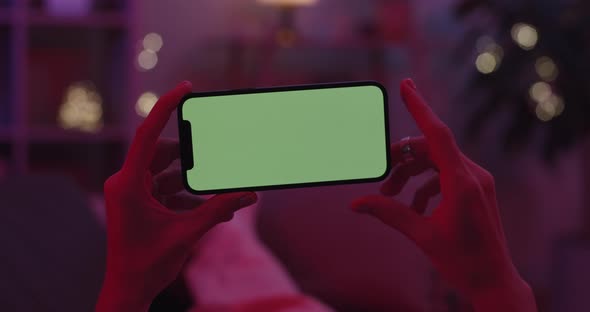 Woman Tapping and Scrolling on Chroma Key Screen of Mobile