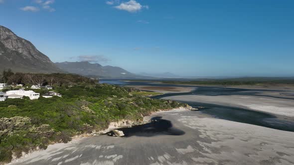 Aerial Drone Shot of Coastal Houses Hermanus Beach on a Sunny Day