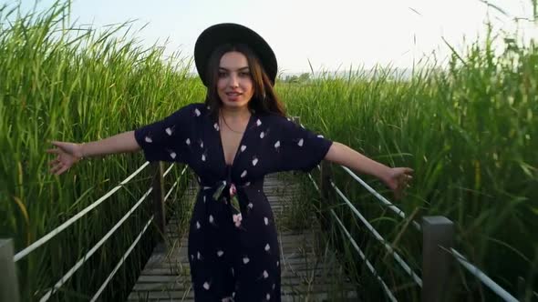 Tourist Woman In The Reeds