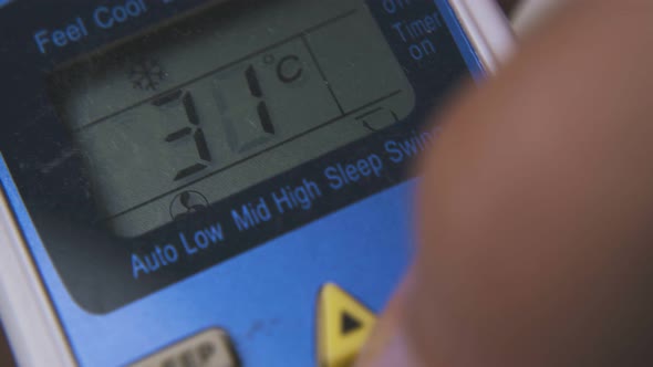 Man Switches on Air Conditioner with Controller Macro