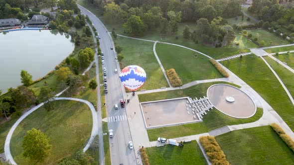 Hot Air Balloon on Ground Before Festival - Aerial Drone Orbiting Overhead