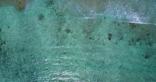 Tropical aerial copy space shot of a white paradise beach and aqua turquoise water background in hi 