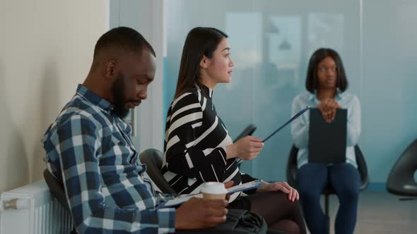 Diverse Group of Candidates Waiting to Be Called at Job Interview