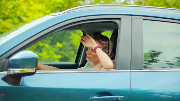 Sick Woman With Headache Sitting On Car. Depressed Tired Stressed Girl. Disappointed Stressed Driver