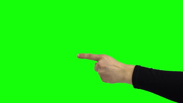 Arm in Black Turtleneck Pointing Something. Green Screen. Close Up