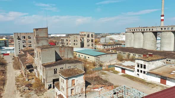 Aerial view of an old factory ruin and broken windows. Old industrial building for demolition.