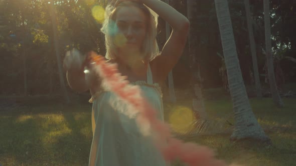 Young Blonde Standing Contemplating Tropical Rainforest Sunset Light Coming From Above