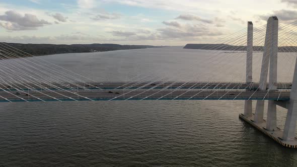 An aerial, profile view of the Mario M. Cuomo Bridge, taken on the north side. The camera truck left