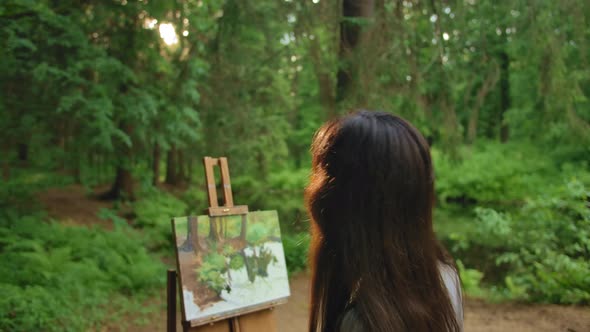 Young Girl Paint a Landscape Oil Painting in a Park
