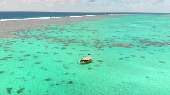 Aerial  view flight over tropical bay lagoon with small recreational boats enjoying the summer day b