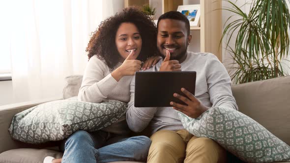 Couple Having Video Call on Tablet Pc at Home