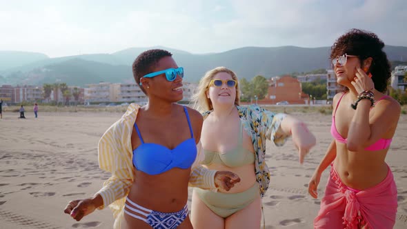 multiethnic young women having fun on the beach