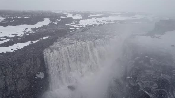 Aerial view over Dettifoss waterfall in Iceland winter landscape