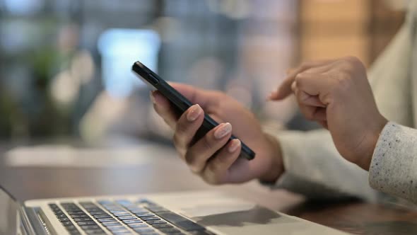 Close Up of African Woman Using Smartphone