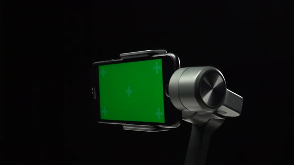 Steadicam Gimbal Stabilizer with Green Screen on Smartphone Spinning Around