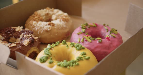 Delicious Sweet Colorful Donuts in Takeaway Box