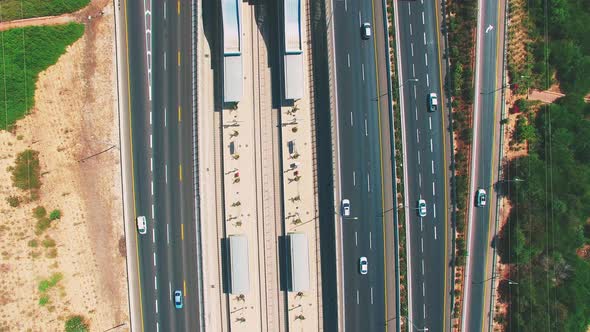 Tilt up Aerial of cars on the highway.