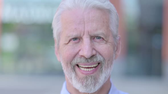 Close Up of Old Man Face Smiling at Camera