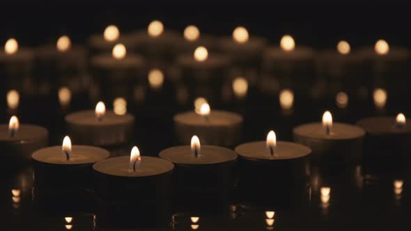 Many Christmas Candles Burning in The Dark. alt