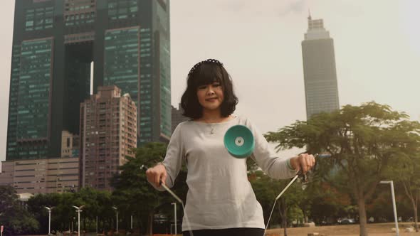 Taiwanese woman playing with a Chinese Yo-Yo