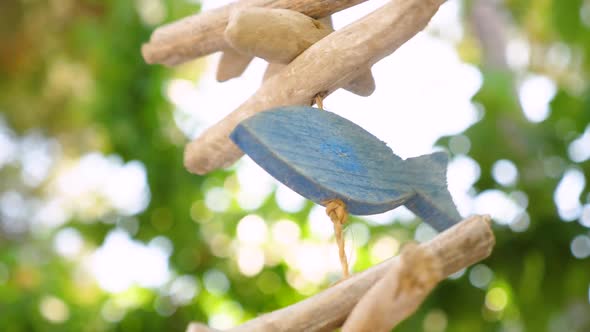 Exterior Decoration. Wind Chimes. Summertime Background. Wooden Wind Chimes Hanging From a Tree.