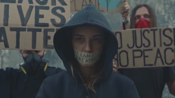 Young Lady and Demonstrators Crowd at Anti Racism March